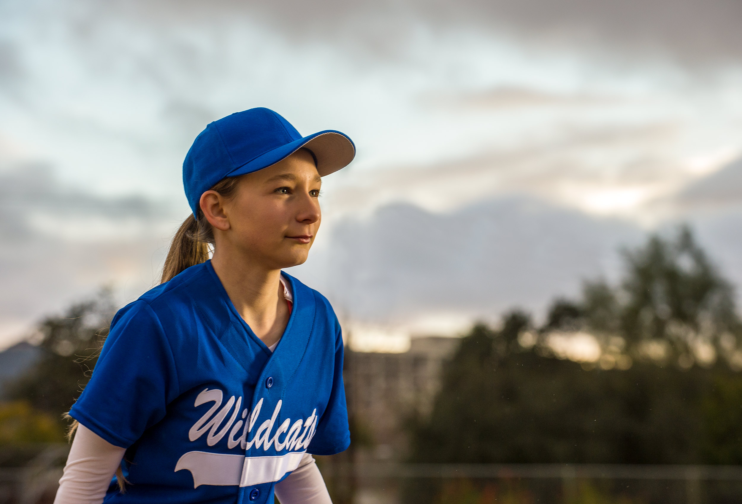 Young girl softball player  by NY lifestyle advertising photographer Kathy Cacicedo for Claritin D campaign