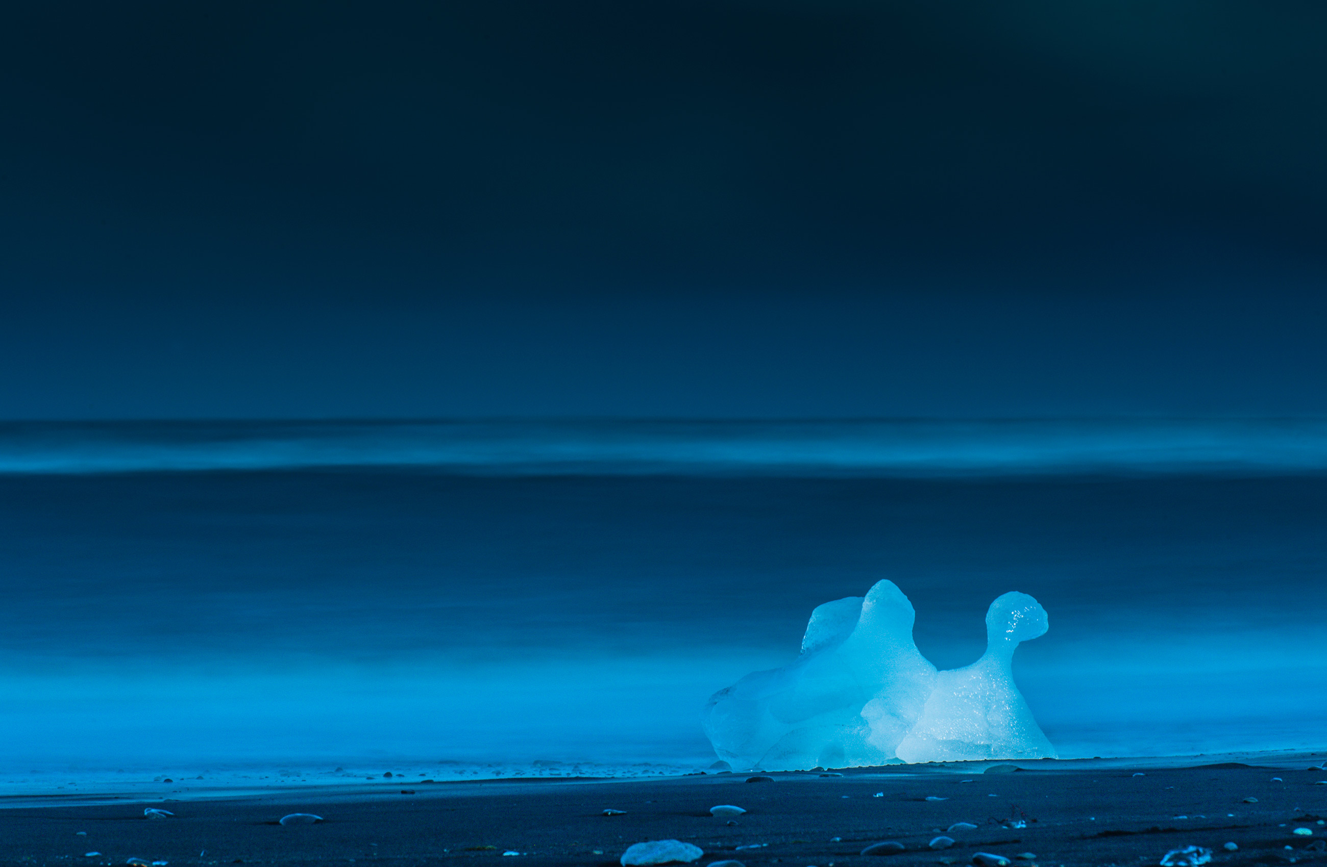 Long exposure of backlit iceberg on Diamond beach Iceland