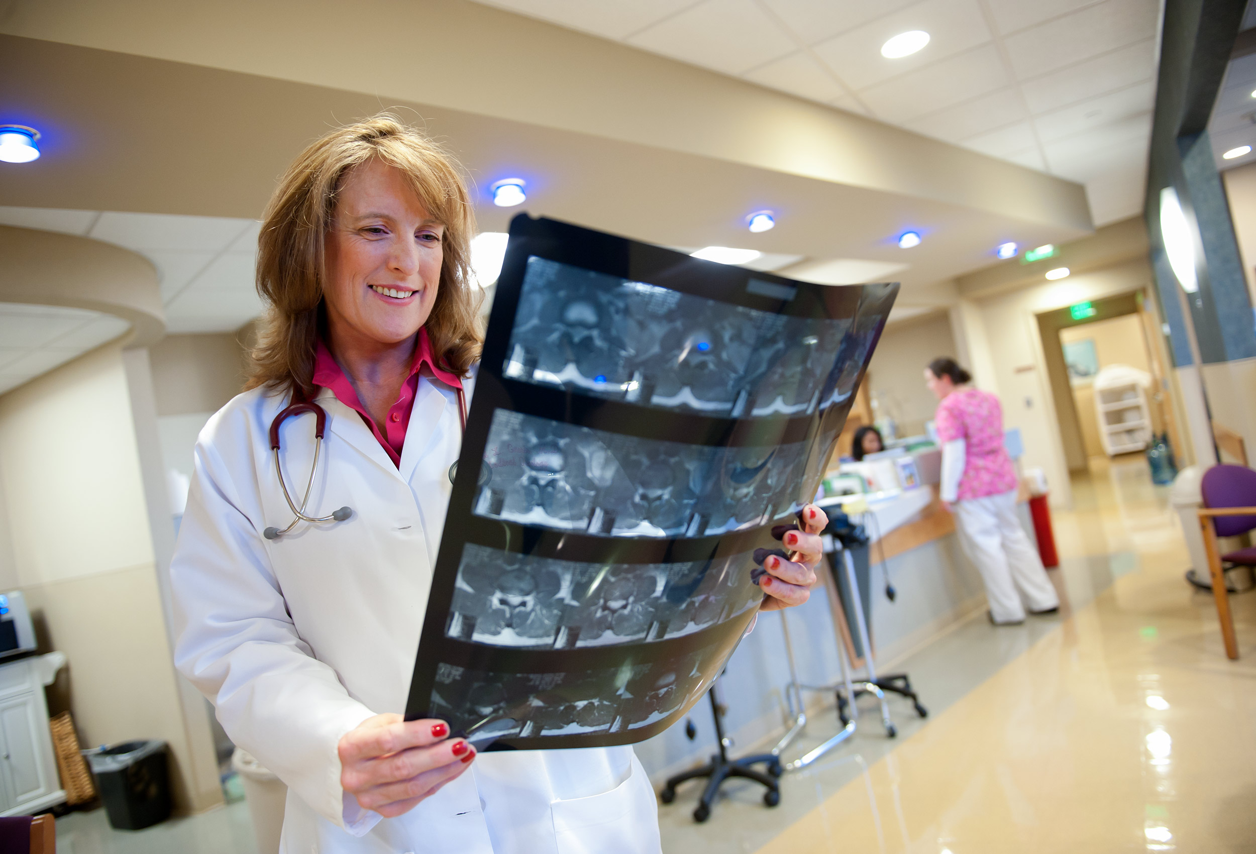 Dr. Bonnie Guerrin looks at x-rays at nurses station in hospital