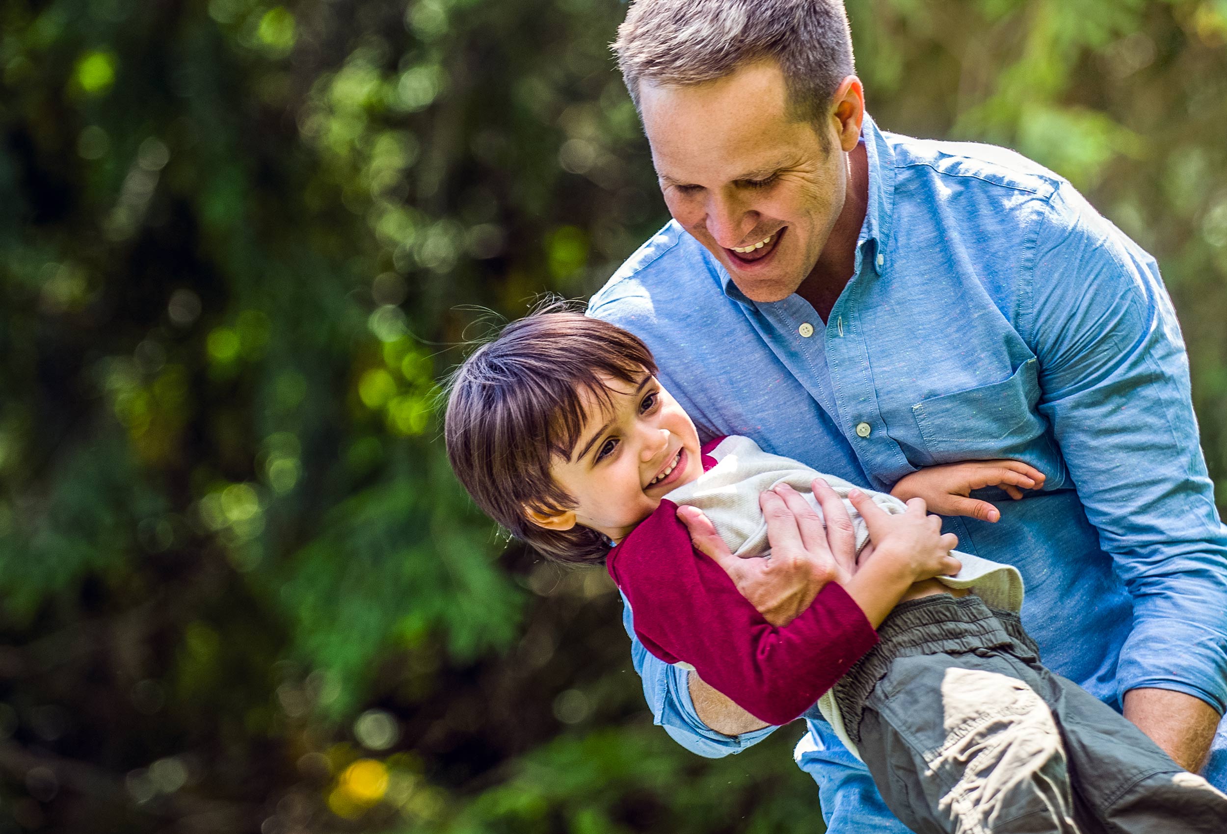 Lifestyle advertising photography for Happy Family Organics - father and son play