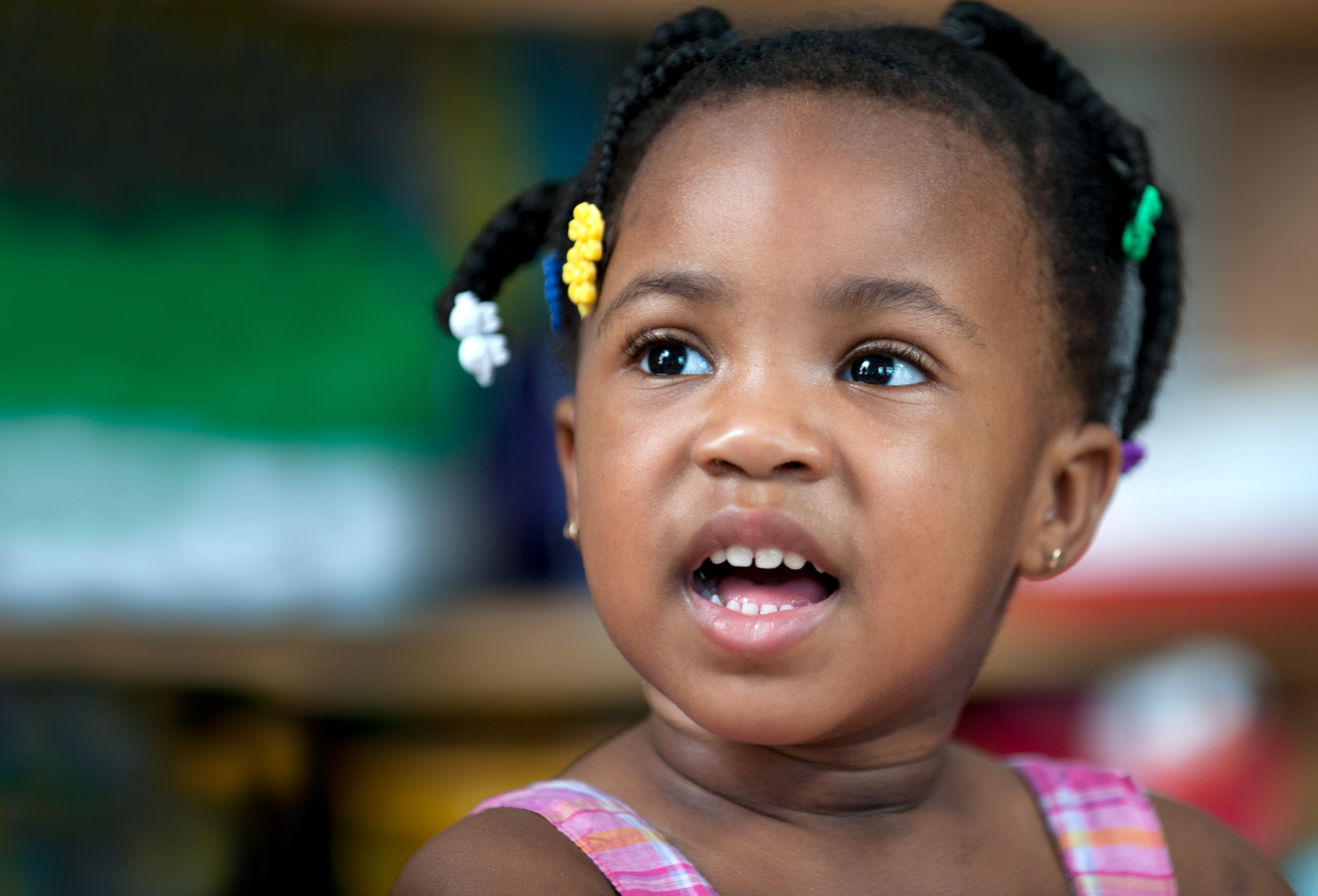 Toddler in colorful classroom
