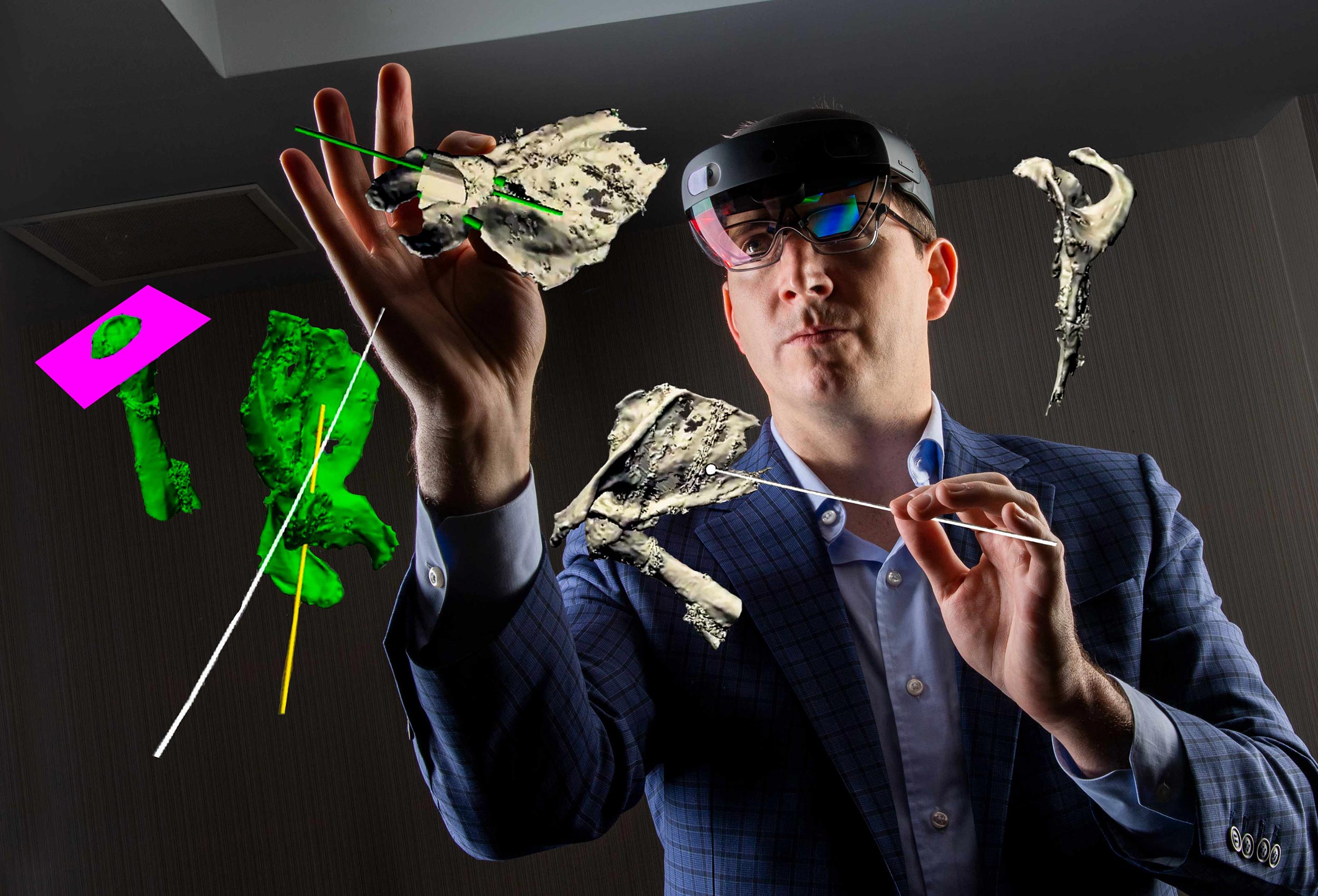 Doctor uses  Hololens-2 mixed reality technology 