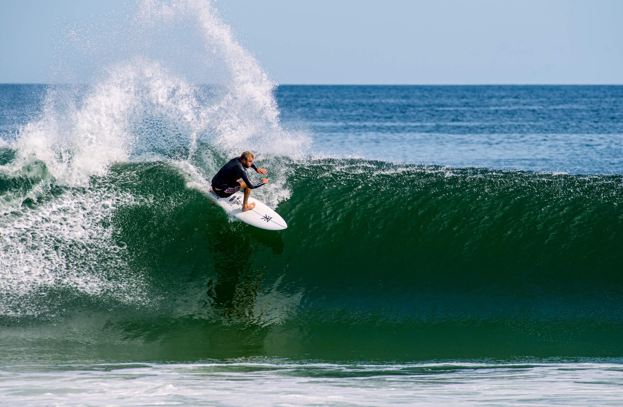 Thomas Ihnken surfs the hurricane Sam swell  in Seaside Heights, NJ
